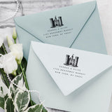 Custom Wedding Venue stamp featuring illustration of the venue and a modern Address Stamp on a blue envelope