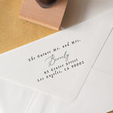A personalized wedding address stamp with the text 'Mr. and Mrs.
