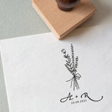 Wedding Logo Stamp featuring a wildflower wedding bouquet and couples initials and wedding date