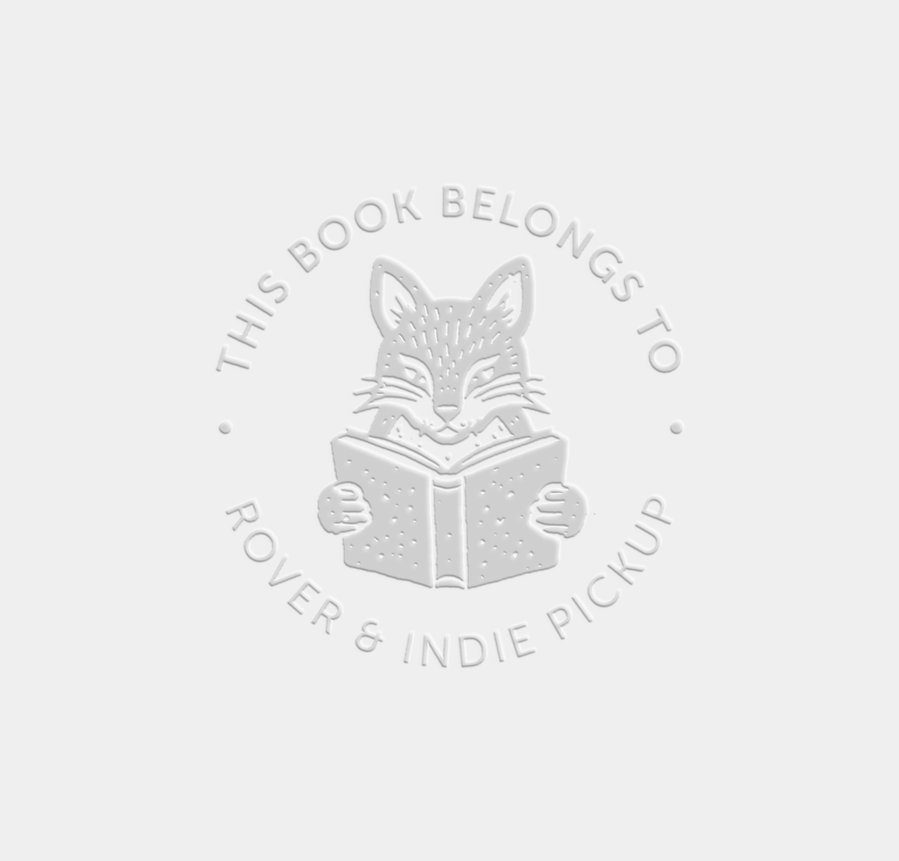 raised impression of an animal design with the wording 'this book belongs to' 