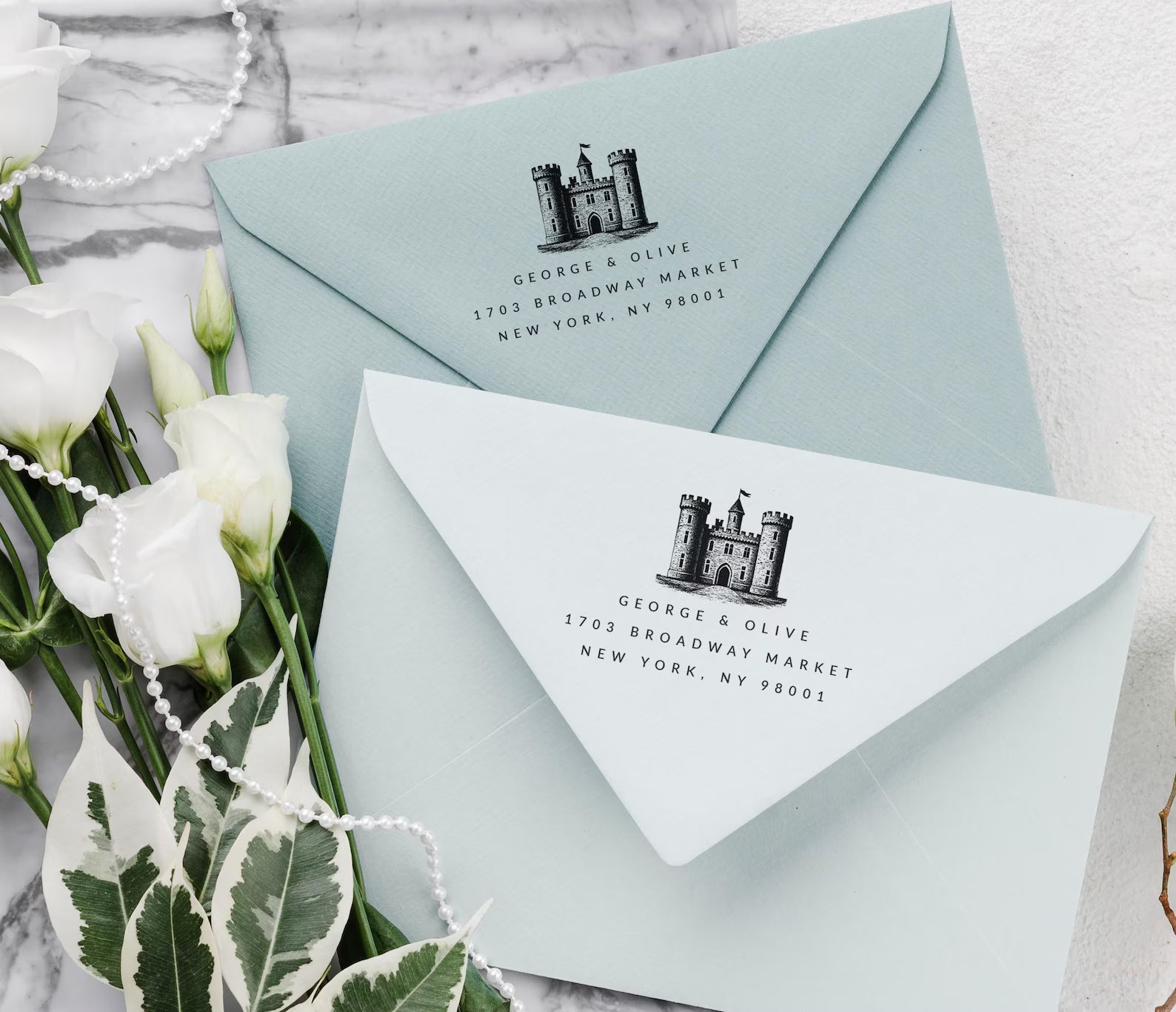 Custom Wedding Venue stamp featuring illustration of the venue and a  modern Address Stamp on a blue envelope