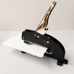 custom long reach embosser embossing a piece of paper 