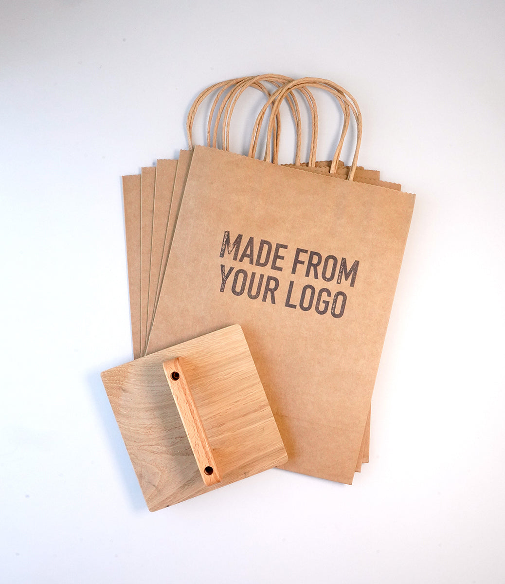 Custom Rubber Stamp making an imprint on kraft Paper Bags 