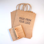Custom Rubber Stamp making an imprint on kraft Paper Bags 