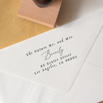 A personalized wedding address stamp with the text 'Mr. and Mrs. 