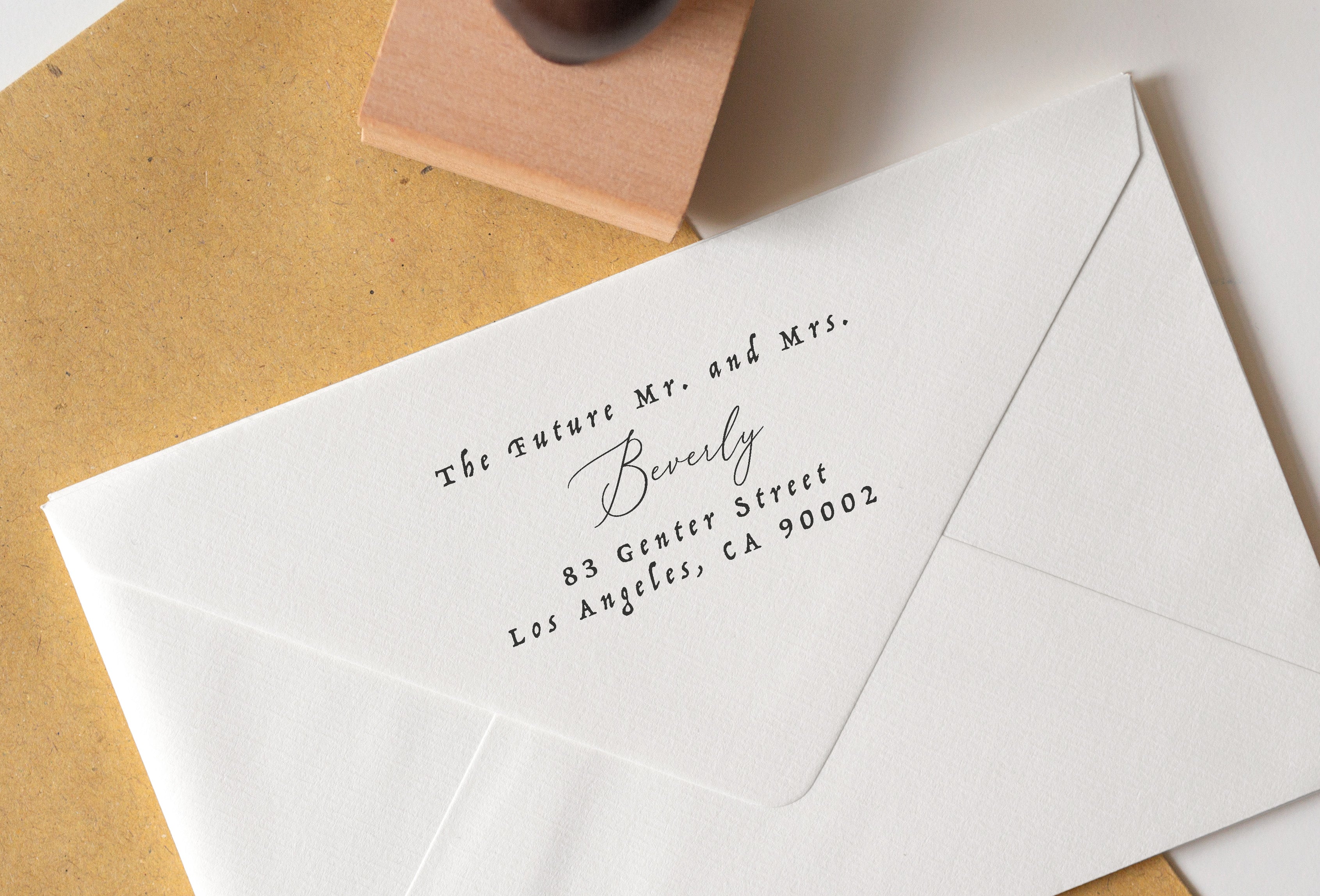 A personalized wedding address stamp with the text 'Mr. and Mrs. 