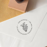 Personalised Birth Flower Address Stamp with flowers in the centre and address details in a circular layout around the flowers stamped onto an envelope 