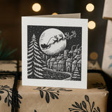 Greeting card with Santa sleigh design