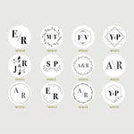 A collection of custom monogram stamps with various initial letters, designed for use on wedding invitations and favors.