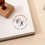 Book with a personalised stamp reading 'From the Library of' and an elegant customised monogram design.