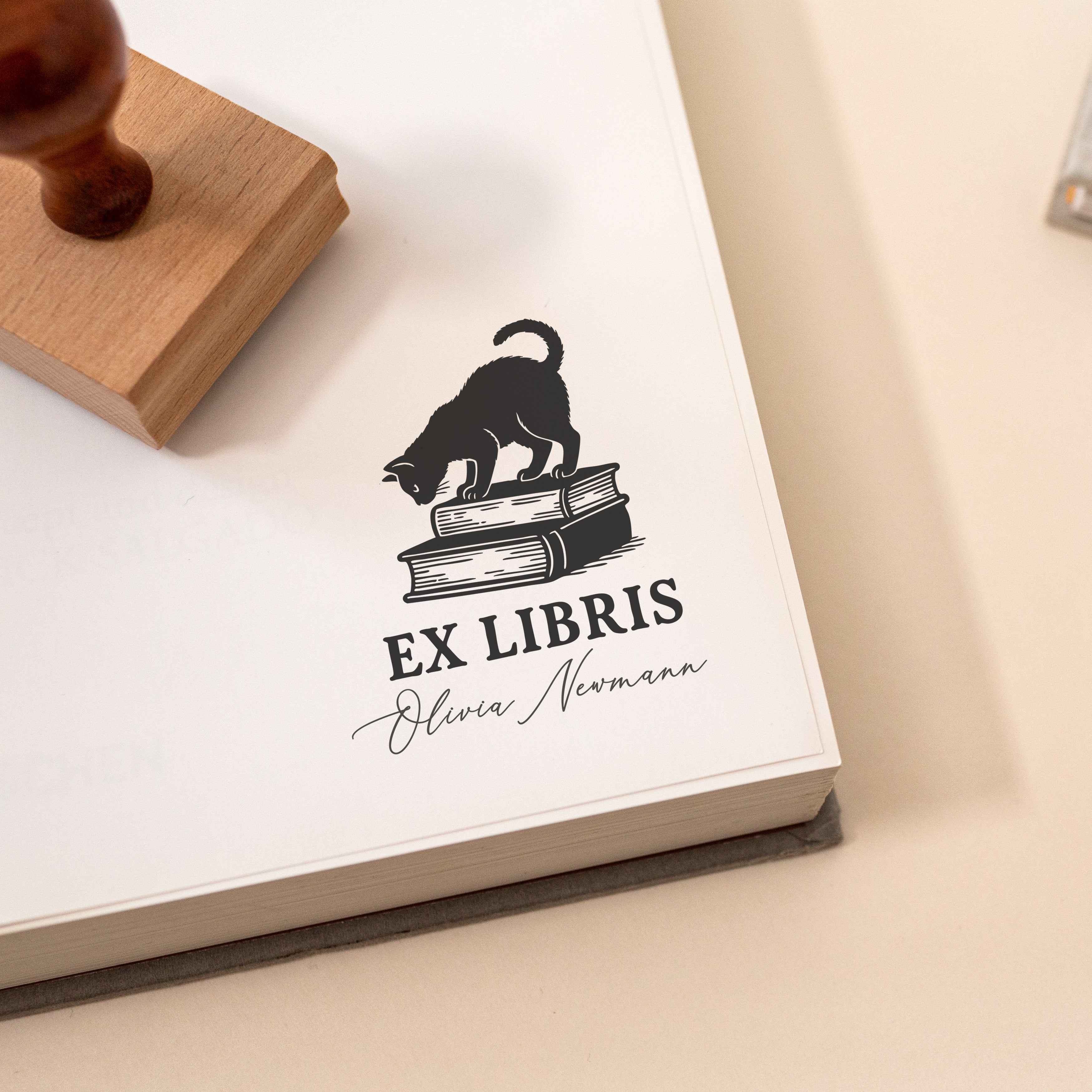 Personalised ex libris book stamp featuring cat standing on stacked books