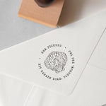 custom beach address stamp featuring a seashell design and a personalised address stamped onto an envelope