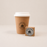 coffee cup stamped with a custom rubber logo stamp without handle 