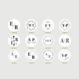 Collection of beautiful monogram designs for a custom wedding embosser on a gray background