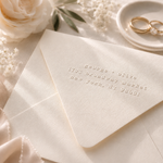 custom address embossed onto a high quality wedding envelope with wedding elements in the background