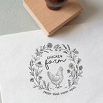 Decorative stamp with chicken illustration, wildflowers and custom text stamped on to a white textured paper