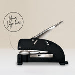 personalised long reach embosser showing a raised impression onto paper