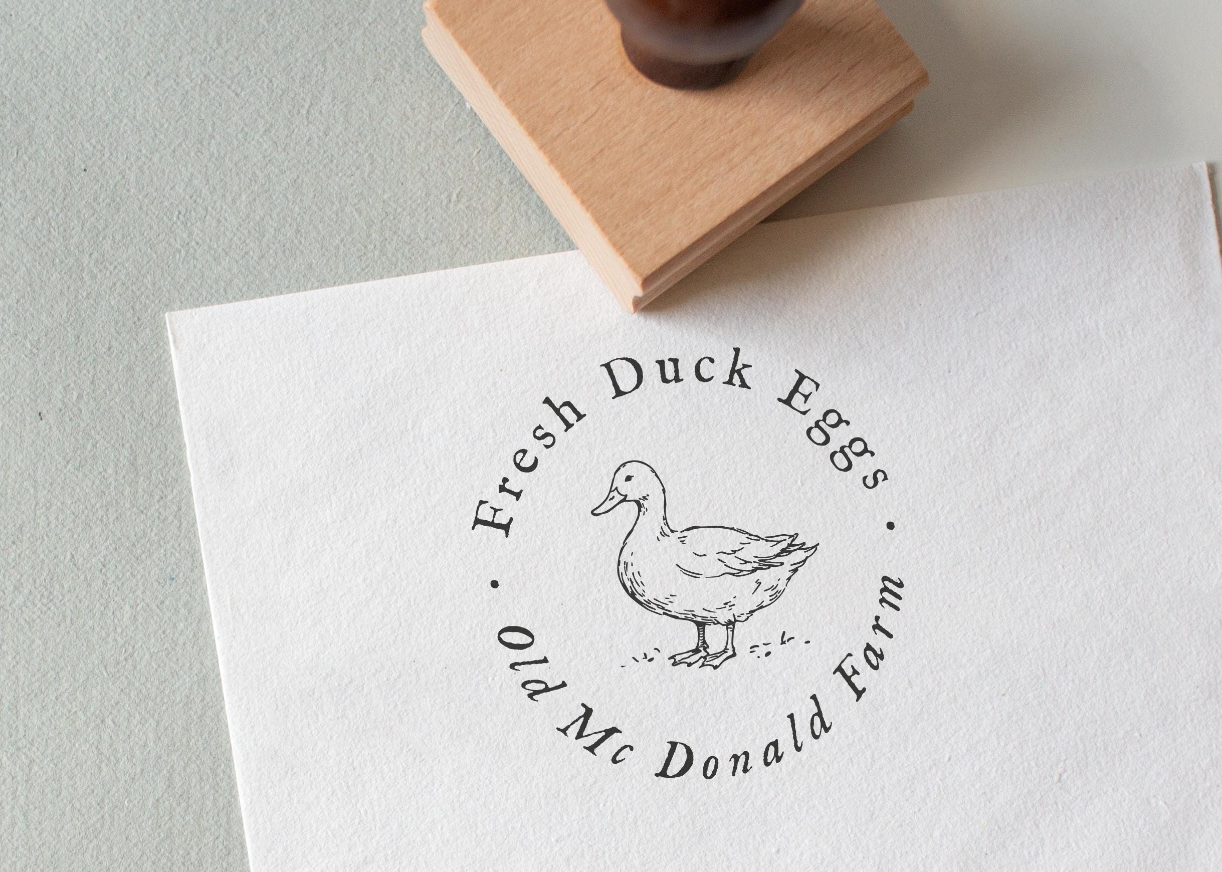 Rubber Stamp with the wording 'Fresh Duck Eggs' text and a duck illustration on white textured paper