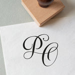 rubber stamp that stamped the initials PO onto a piece of paper, perfect for wedding stationery 