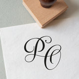 rubber stamp that stamped the initials PO onto a piece of paper, perfect for wedding stationery 