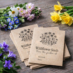 Personalised wildflower seed packet rubber stamp on kraft envelopes with botanical wildflower illustration and custom text