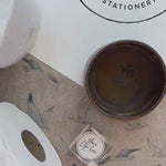 Video of a toilet roll stamp or pixie stamp being used on a toilet roll and leaving a raised logo impression in to the toilet roll 
