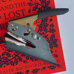 Custom book embosser with books and teacup design