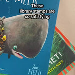 Kids Book Rubber Stamp featuring a beautiful illustration of an owl reading a book with the wording 'this book belongs to' being stamped onto a book page