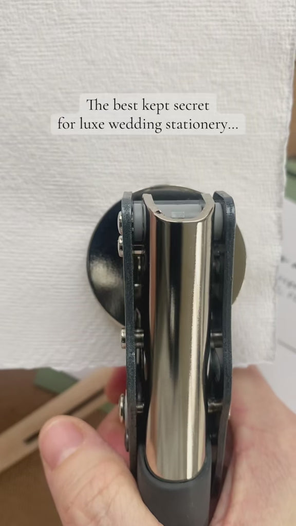 a video of the best kept secret for luxe wedding stationery: a custom wedding botanical initials embosser