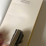 Video featuring an eco-friendly, green,  self-inking logo stamp stamping a logo with the wording 'your logo here' onto brown kraft paper