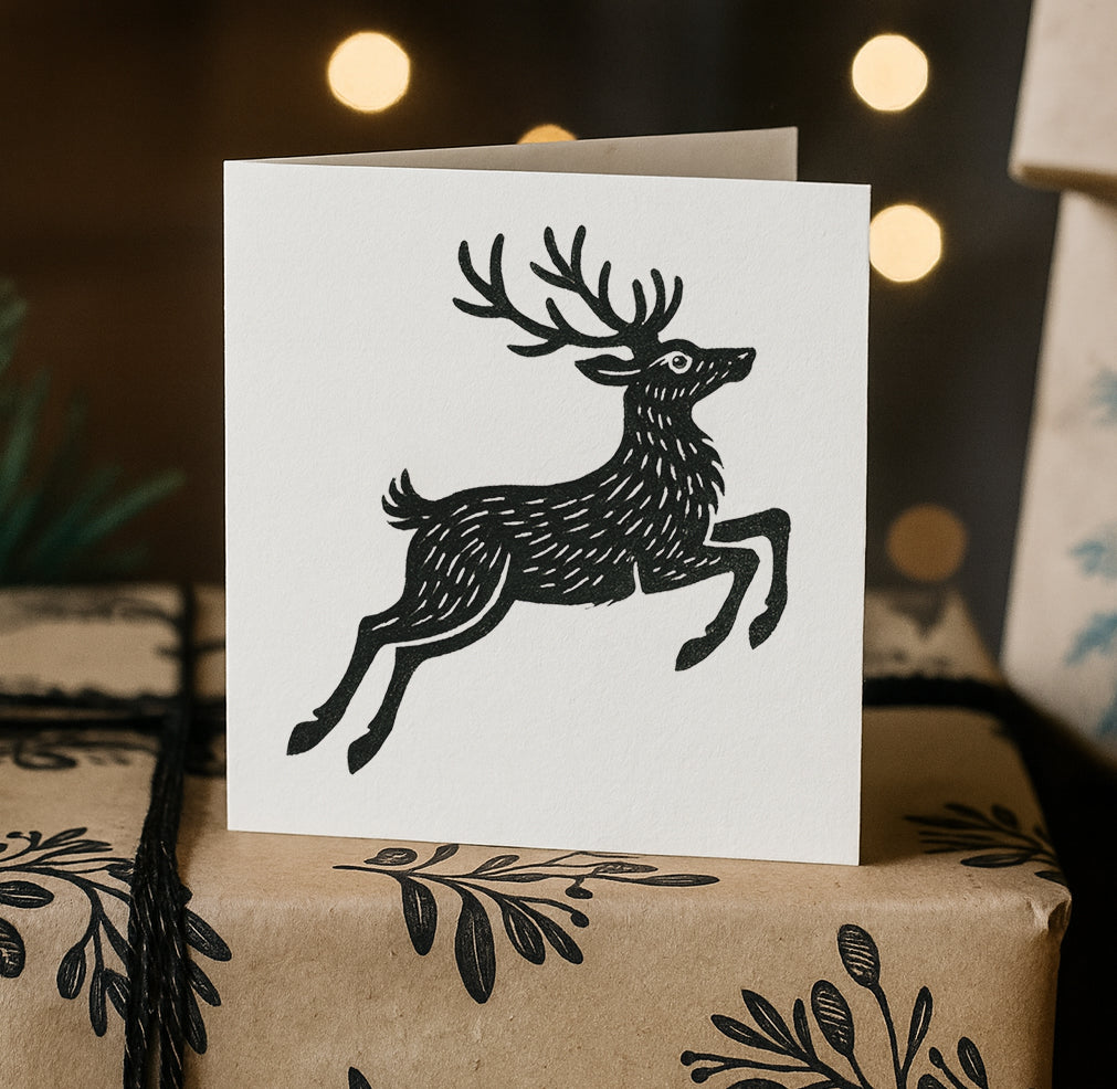Rubber Stamp featuring a beautiful black and white illustration of a reindeer, stamped onto white paper
