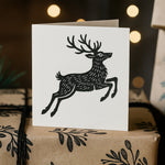 Rubber Stamp featuring a beautiful black and white illustration of a reindeer, stamped onto white paper