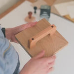 Custom Large Rubber Logo Stamp stamping the 'about you stationery' logo onto a big sheet of white paper 