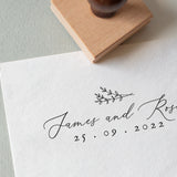 Elegant Wedding Stamp with Names and Date and a botanical illustration stamped on white textured paper paper