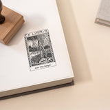 Personalised ex libris stamp with vintage forest illustration on book page
