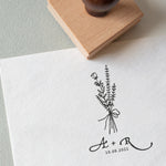 Wedding Logo Stamp featuring a wildflower wedding bouquet and couples initials and wedding date